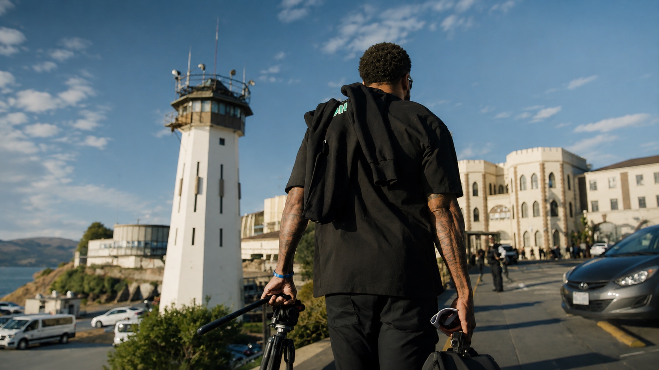 Carrying camera gear up the road toward San Quentin State Prison